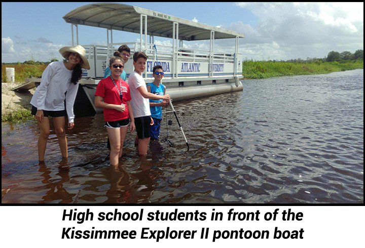 High school students in front of the  Kissimmee Explorer II pontoon boat